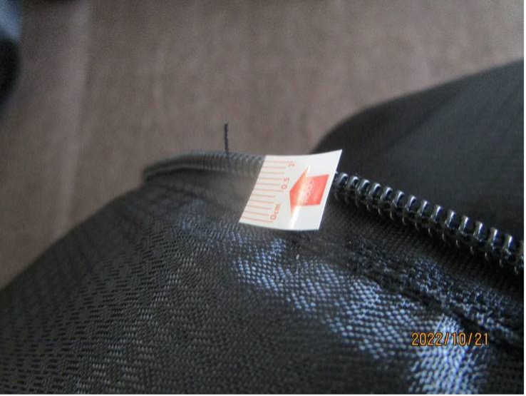 Untrimmed Thread End on carry bag